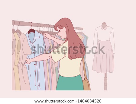A woman is picking clothes in the women's clothing department. hand drawn style vector design illustrations. 