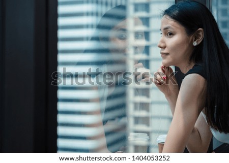 portrait of Asian female executive take a break after work