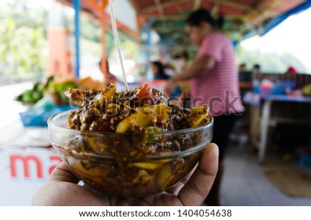 mixed fruit with sweet nutty sauce, a traditional food in Ambon