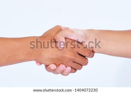 Two businessmen do shaking hand to make a deal of the buisness isolated on white background