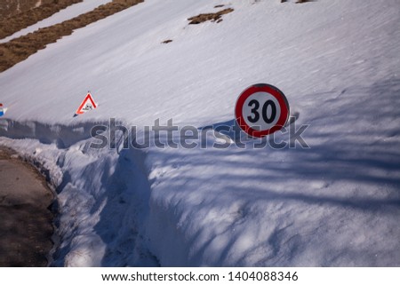 Road sign in the snow on the road to arrive in Castelluccio di Norcia, Umbria, Italy