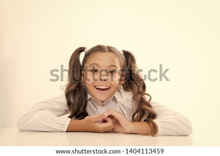 Excellent pupil lean on desk isolated white. Perfect schoolgirl with tidy fancy hair. School hairstyle ultimate top list. Prepare kid first school day. Schoolgirl happy smile cute ponytail hairstyle.