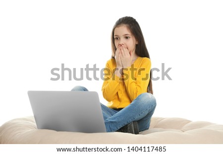 Little girl using video chat on laptop against white background