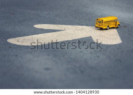 Yellow school bus toy model.Back to school /Education concept background.