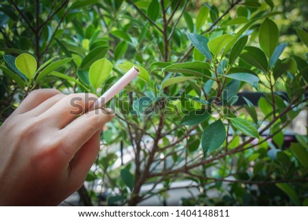 woman tries to smoke cigarette in public area which is prohibited