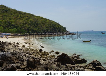 Islands in thailand Beach in Andaman Sea within have mountain and rock and sand.