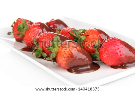 Strawberry dipped in chocolate fondue isolated on white