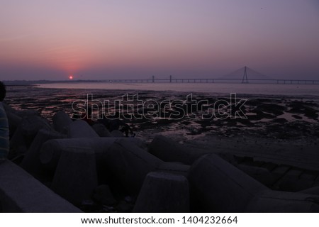 Its sunset view of famous Bandra Worli sea link in Mumbai. I took this picture from Dadar Chowpati. For beautiful sunsets you can visit this place