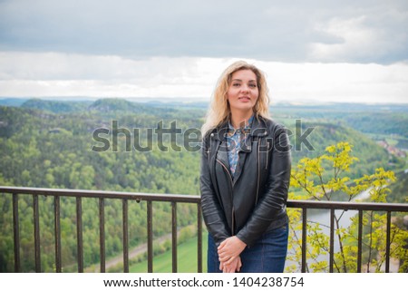 Woman travelling to Rock Bridge Bastei and nature views - Saxon Switzerland, Germany