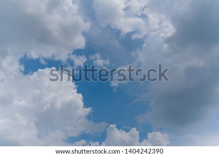 Beautiful bright blue sky with white fluffy clouds on a clear sunny day. Royalty high-quality free stock time lapse footage of blue sky with white cloud. Time lapse of natural cloudscape background