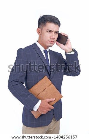 Asian young attractive handsome business man with smart phone, wear suit, isolated on white background