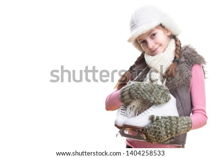 Tranquil Positive Caucasian Blond Girl in Winter Clothes Posing with Ice Skates In Hands In Front. Against Pure White Background.Horizontal image