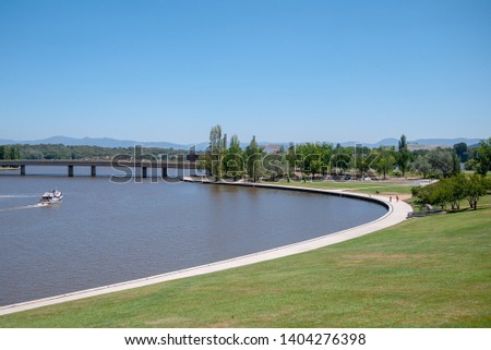 Commwealth Avenue and Lake Burley Griffin with the National Museum of Australian in the Background, viewed from Commonwealth Park, Canberra, Australia Royalty-Free Stock Photo #1404276398