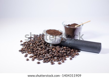 Coffee powder and Roasted coffee beans in coffee maker, Black coffee