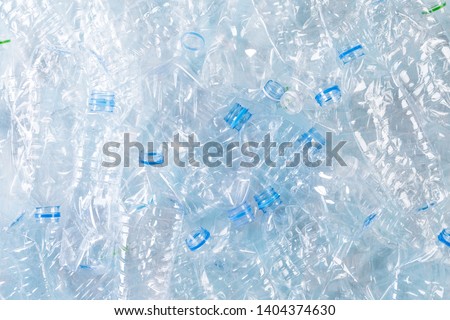 Top view of blue plastic bottles background. Recycle and World Environment Day concept Royalty-Free Stock Photo #1404374630