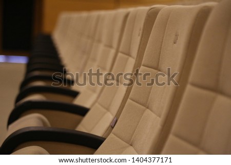 yellow colored empty theater seats