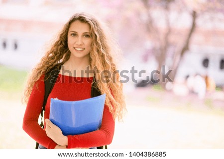 Smiling young teenager female student