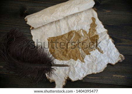 map of united states of america on vintage paper with old pen on the wooden texture desk background