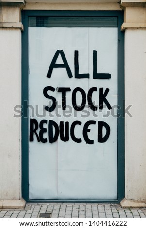All stock reduced - empty shop window - closing down sale