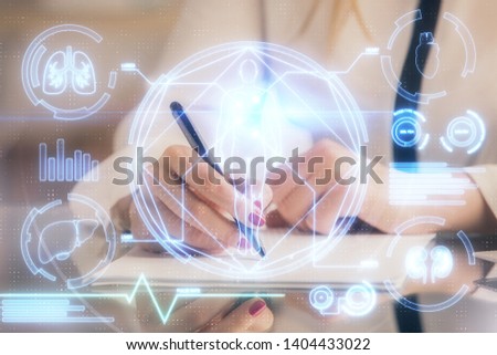 Education theme hologram over woman's hands writing background. Concept of study. Double exposure