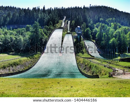 Wielka Krokiew - ski jump located in the city of Zakopane in southern Poland, next to Tatra mountains range. Photo taken in summer. Jump is covered with plastic instead of snow. 