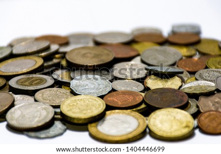 A picture showing various currencies piled on other currencies. Each currency representing its value.