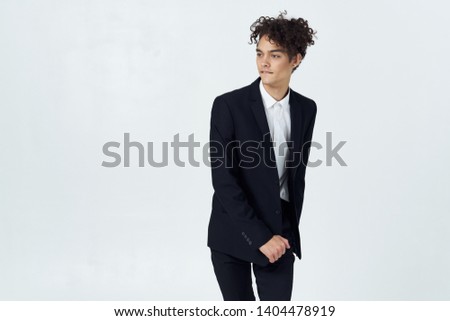 Business man in a suit with curly hair work
