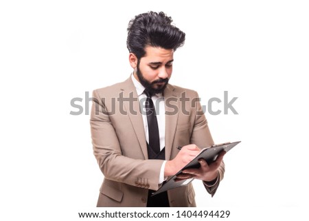 Young positive caucasian businessman holding clipboard, isolated on white, toothy smile