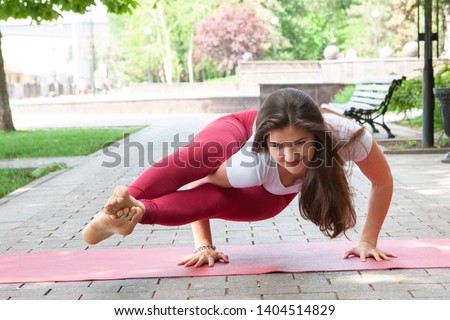 Woman on a yoga mat to relax outdoor. Portrait