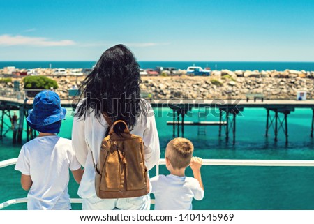 Mother with her sons standing on ferry deck while arriving at Penneshaw, Kangaroo Island