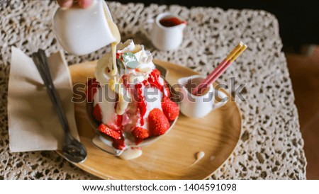 Strawberry bing su with milk and Strawberry Sauce