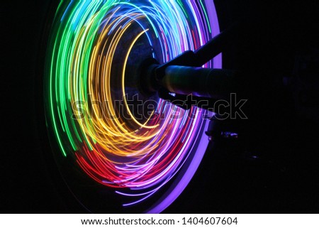 Light Photography - Long exposure of lights attached to a bicycle wheel.