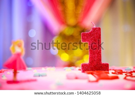 First Birthday cake with barbie girl on it. pink cake for birthday party on blurry background - Image