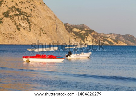 Two pedal boats pictured in Laganas bay at the golden hour. Kalamaki, Zakynthos. Greece