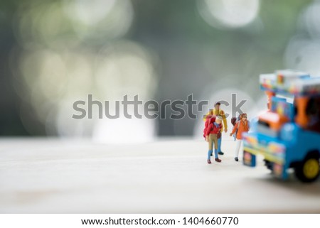 Miniature people : Traveler with backpack hitchhiking Thai farming trucks, Travel and Adventure concepts in Thailand and hitchhiking concept