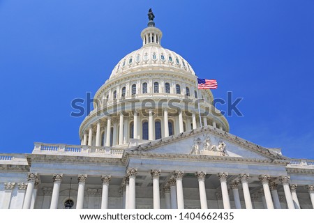 National Capitol building with US flag, Washington DC Royalty-Free Stock Photo #1404662435