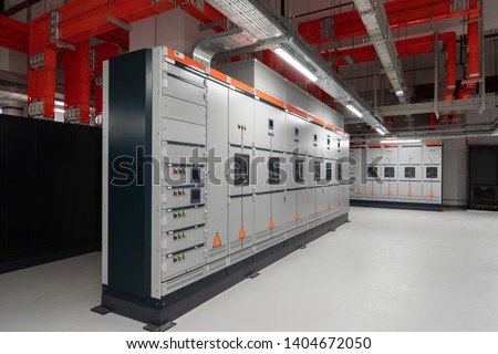 Low voltage switchboard. Electrical switch panel of switchgear room at power plant. Royalty-Free Stock Photo #1404672050