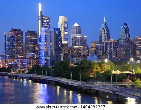Philadelphia skyline at dusk with the Schuylkill River on the foreground, USA