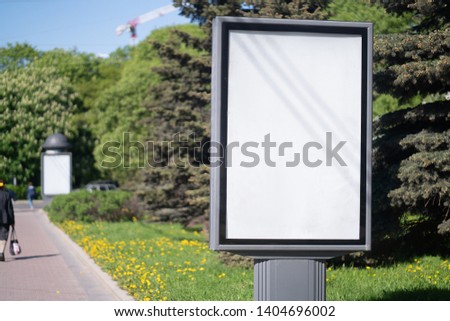 vertical billboard standing in the city. with white advertising space mockup