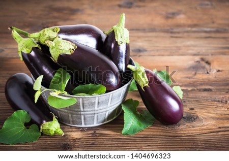 Frsh organic eggplant on the table Royalty-Free Stock Photo #1404696323