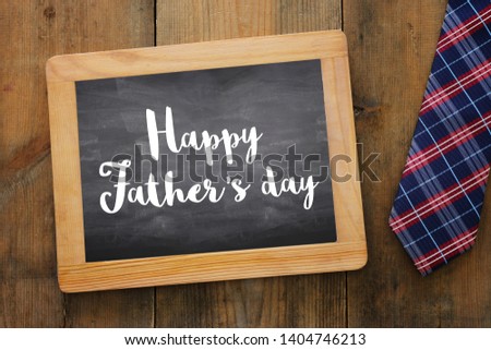 Father's day concept. Necktie over wooden background. top view, flat lay