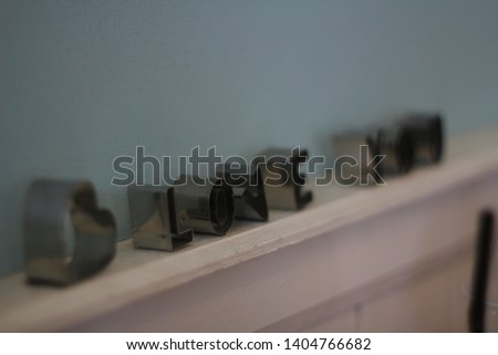 latter steel on wood wall