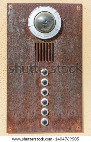 Old rusty house bell with camera and intercom, Germany