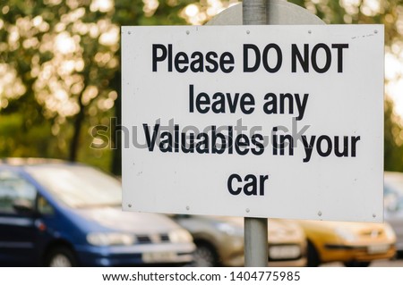 Sign in a car park warning drivers not to leave any valuables in their car