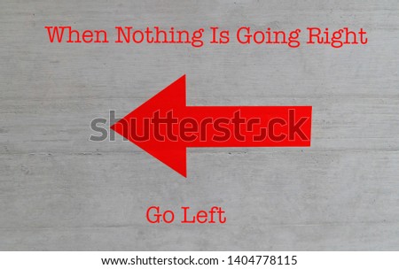A bright red arrow pointing left on a conrete wall with humorous text.