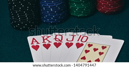 Poker Hands / Royal Flush 3. Five playing cards - the poker royal flush hand. Royal Flash,red card deck, poker royal flash on cards and poker chips on green casino table. success in gambling.