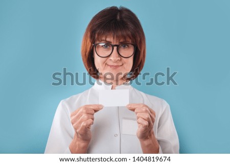 Doctor or medical worker showing business card with blank space for text