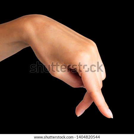Female hand showing walking or dancing fingers on black background. Isolated with clipping path.