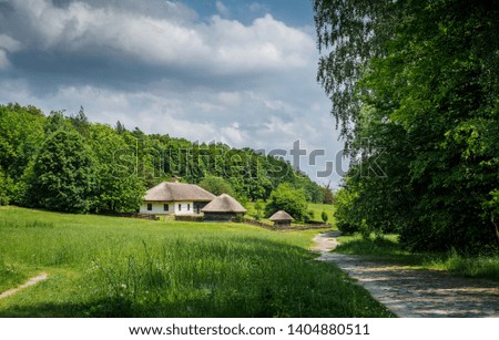 Beautiful traditional Ukrainian country village, idyllic sunny landscape