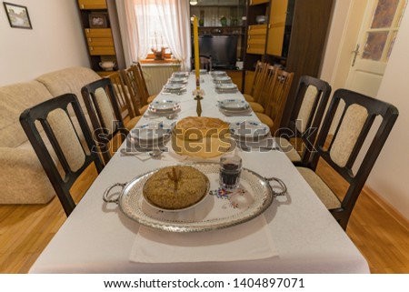 Boiled wheat and wine on a table put on the table as a part of an Orthodox Christian tradition Royalty-Free Stock Photo #1404897071
